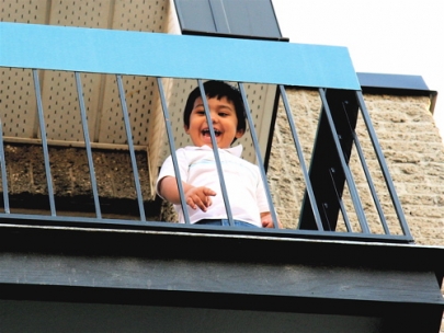 he's laughing because he threw a toy car at me. ha ha.