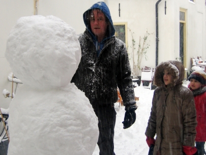 looking up to their first snowman