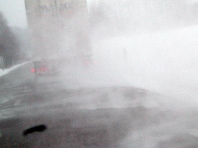 on the road in the snow storm